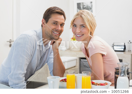 Young couple having breakfast at home 10051266