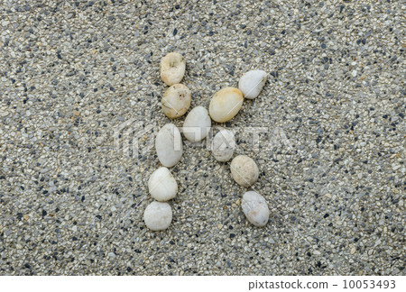 K - Letter alphabet stones laid out on the granite 10053493