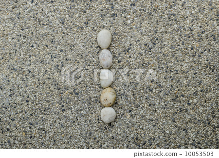 I - Letter alphabet stones laid out on the granite I - Letter alphabet stones laid out on the granite 10053503