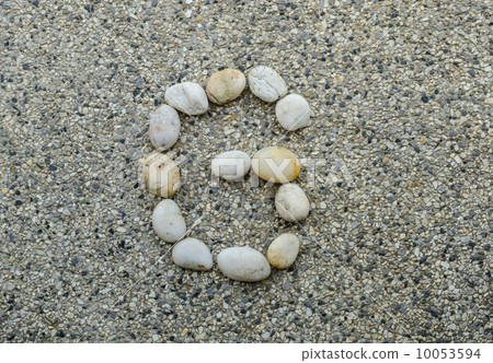 G - Letter alphabet stones laid out on the granite 10053594
