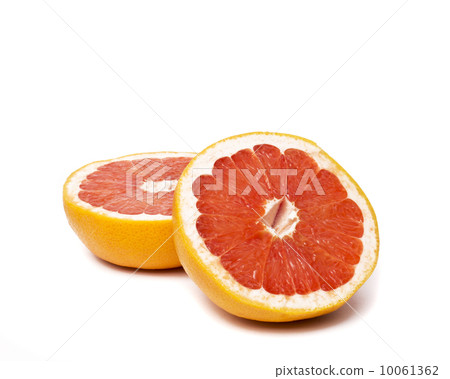 Grapefruit with slices on a white background. Grapefruit with slices on a white background. 10061362