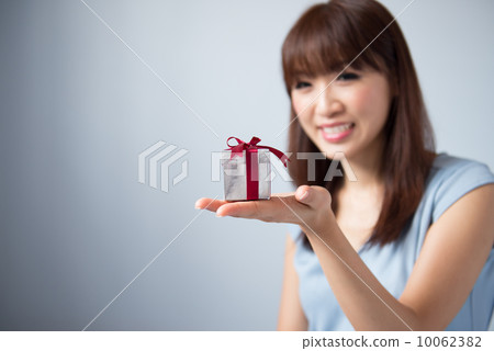 Asian Girl Holding Gift Box 10062382