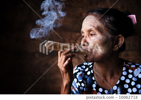 Old Asian woman smoking Old Asian woman smoking 10062718