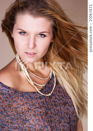 Beautiful blonde girl with long flying hair 10063831