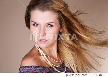 Beautiful blonde girl with long flying hair Beautiful blonde girl with long flying hair 10063832