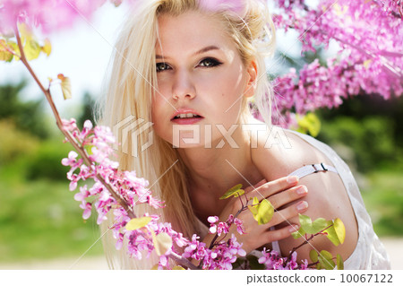 Young woman with purple flowers 10067122