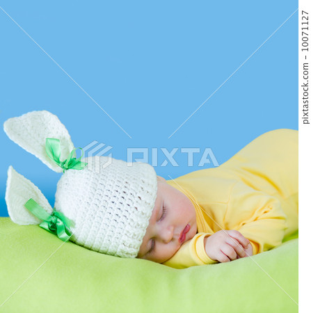 sleeping baby closeup portrait in hare or rabbit hat with expand 10071127