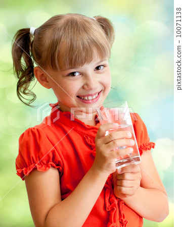 Schoolgirl portrait with water glass outdoor Schoolgirl portrait with water glass outdoor 10071138