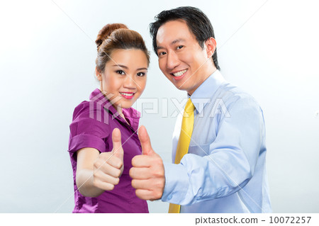 Motivated colleagues in Asian business office 10072257