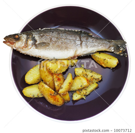 top view of fish and fried potatoes on plate top view of fish and fried potatoes on plate 10073712