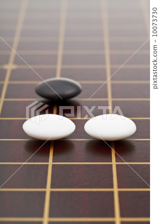three stones during go game playing three stones during go game playing 10073730