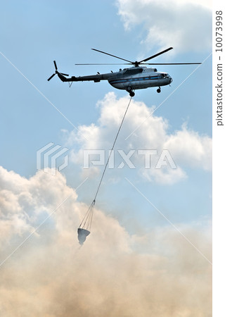 Helicopter at fire Helicopter at fire 10073998