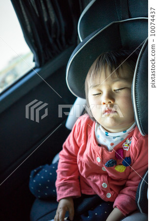 Infant taking a nap on a junior seat Infant taking a nap on a junior seat 10074437