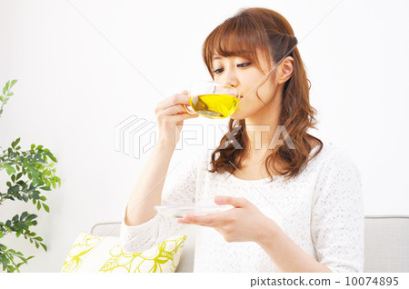  Women drinking herbal tea 10074895