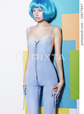Vogue. Shapely Young Woman in Blue Overalls and Creative Wig posing Vogue. Shapely Young Woman in Blue Overalls and Creative Wig posing 10077647