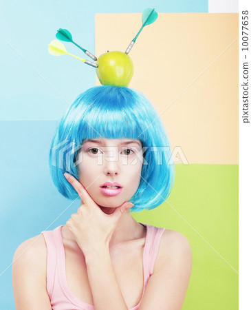Creativity. Woman with Painted Blue Hairs and Apple on her Head 10077658