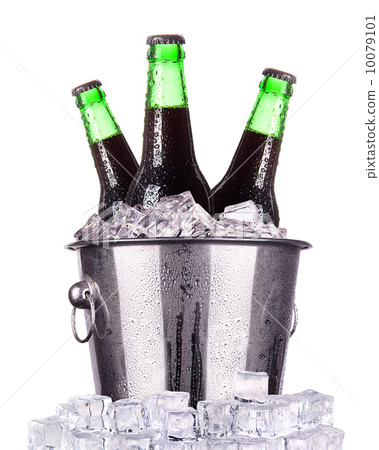 Beer bottles in ice bucket isolated Beer bottles in ice bucket isolated 10079101