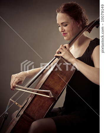 Smiling Cellist playing her old cello Smiling Cellist playing her old cello 10079149