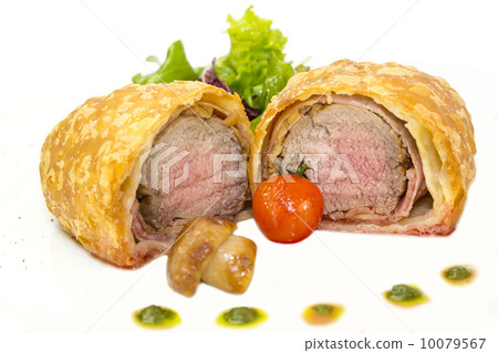 beef in pastry with salad on the table in a restaurant beef in pastry with salad on the table in a restaurant 10079567