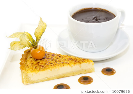 piece of cake with passion fruit and a cup of hot chocolate 10079656