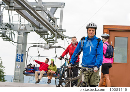 Couple getting on bicycles chair lift trip 10081546