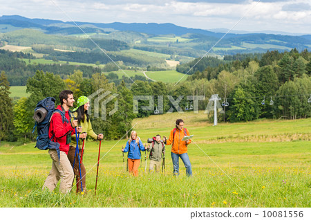 Young trekking people enjoying scenic landscape Young trekking people enjoying scenic landscape 10081556