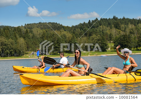 Young people sunbathing on kayak Young people sunbathing on kayak 10081564
