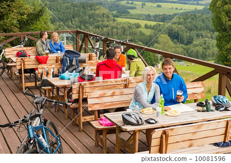 Young people relax looking at mountain landscape Young people relax looking at mountain landscape 10081596