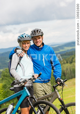 Sporty couple enjoying fresh air bicycles nature Sporty couple enjoying fresh air bicycles nature 10081600