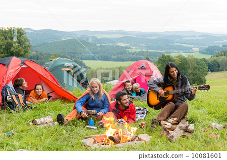 Camping students listening girl with guitar tents Camping students listening girl with guitar tents 10081601