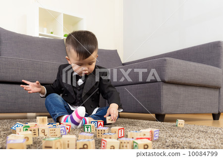 Asia baby boy play wooden toy block Asia baby boy play wooden toy block 10084799