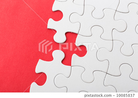 White puzzle on red background 10085837