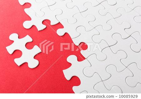 Incomplete puzzle with missing piece over red background Incomplete puzzle with missing piece over red background 10085929