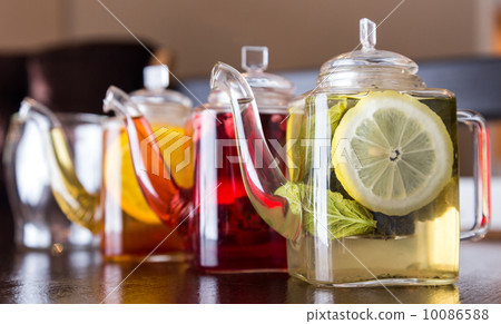 three square teapots with different fruit tastes of tea 10086588