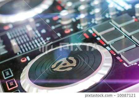 DJ turntable sound mixer in nightclub DJ turntable sound mixer in nightclub 10087121