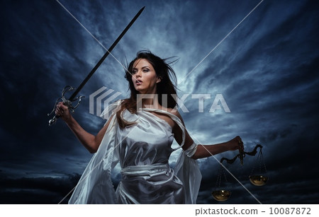 Femida, Goddess of Justice, with scales and sword against dramatic stormy sky Femida, Goddess of Justice, with scales and sword against dramatic stormy sky 10087872