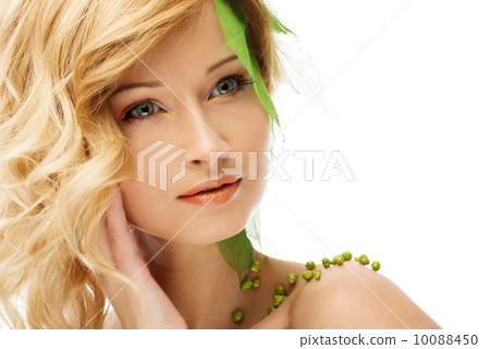 Beautiful young woman in conceptual spring costume touching her face Beautiful young woman in conceptual spring costume touching her face 10088450