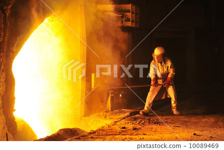 worker takes a sample at steel company 10089469