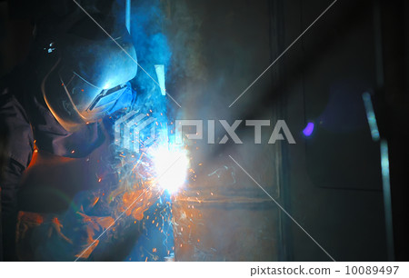 Industrial worker welding in factory Industrial worker welding in factory 10089497