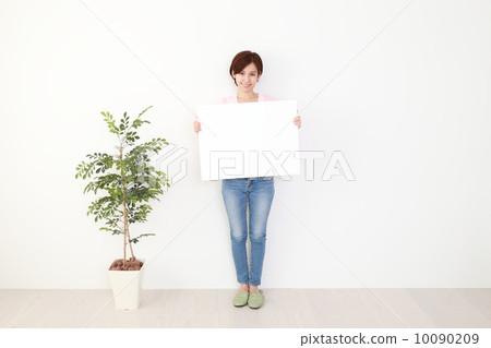 A woman with a white board A woman with a white board 10090209
