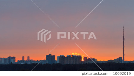 Early pink dawn over city in spring 10092019