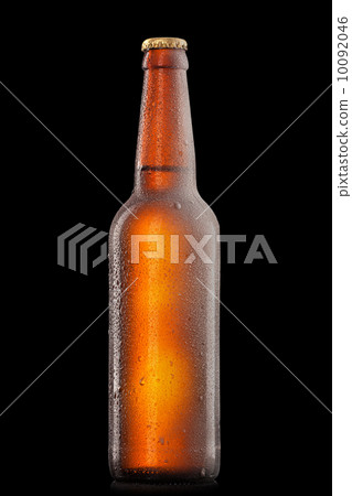 Beer bottle with water drops and frost isolated on black 10092046