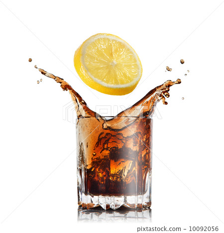 splash of cola in glass with lemon isolated on white 10092056
