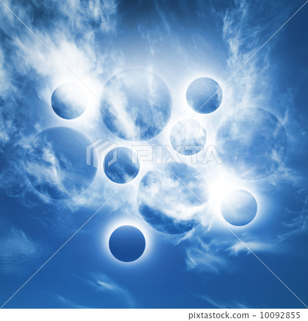 Abstract fantasy background with glowing planet spheres in blue sky with clouds Abstract fantasy background with glowing planet spheres in blue sky with clouds 10092855