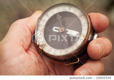 Vintage Soviet military compass in man's hand 10093504