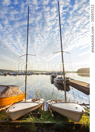 Two small sailboats on the coast of Saimaa lake in Imatra town, Finland 10093522