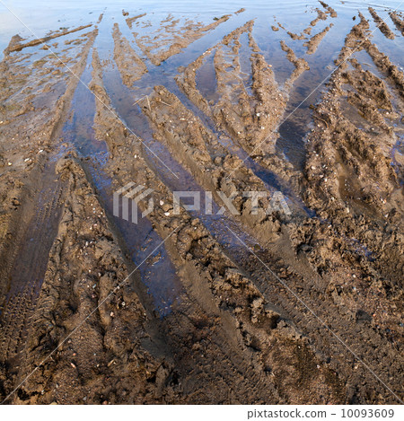Dirty road with mud and tire tracks Dirty road with mud and tire tracks 10093609