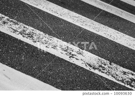 Pedestrian crossing road marking on dark asphalt Pedestrian crossing road marking on dark asphalt 10093630