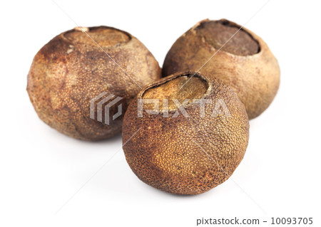 Dried mandarins with black puer tea inside isolated on white 10093705