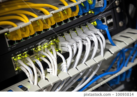 Large network hub and connected Internet cables. Selective focus Large network hub and connected Internet cables. Selective focus 10093814